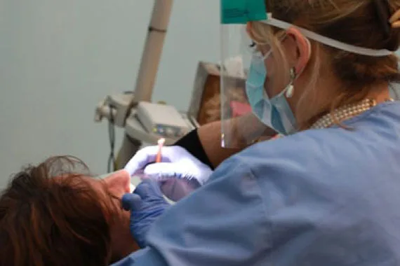 Hygienist caring for a patient